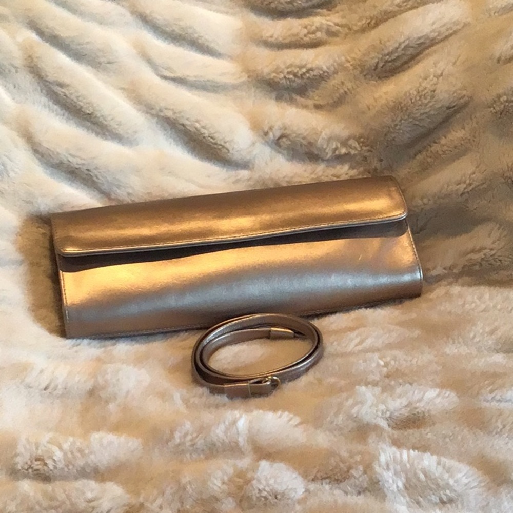 Stuart Weitzman platino leather clutch bag.